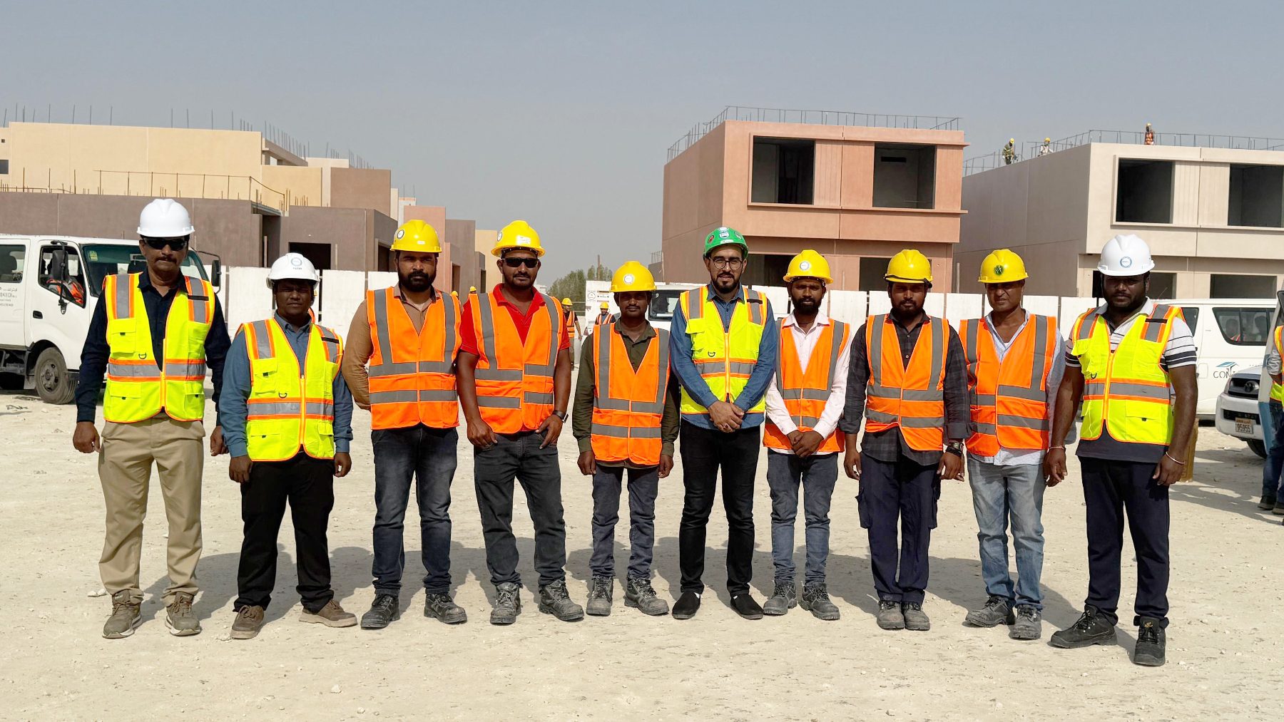 The LEAP W.L.L site team assembled in high-visibility vests at a residential development in Bahrain